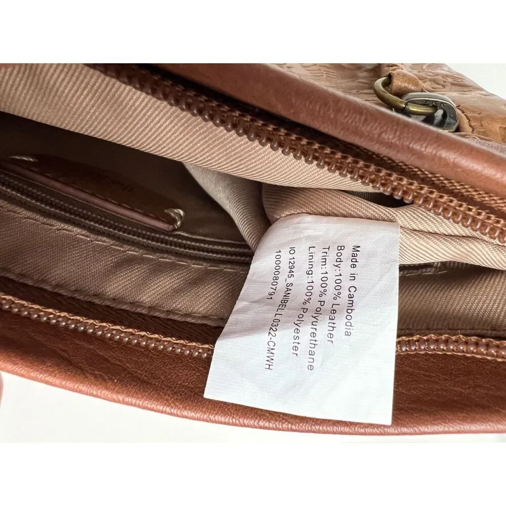 The Sak matte floral embossed tan leather Sanibel crossbody bag
